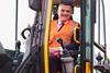 Transport-Minister-Mark-Harper-in-the-cab-of-the-JCB-Pothole-Pro65468-e1698833065345-678x381