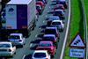 warning sign of queues ahead at traffic jam at roadworks on the A1/M1 motorway near Leeds Yorkshire UK